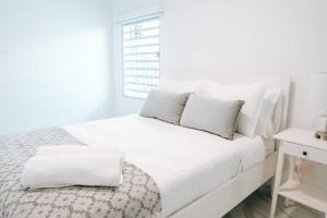 Giường trong phòng chung tại Family Cozy Apt 1 w/ 4 Beds & Sofa Bed @ Santurce - Barrio obrero apt 1