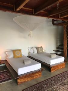 Een bed of bedden in een kamer bij Todo Bien Nicaragua