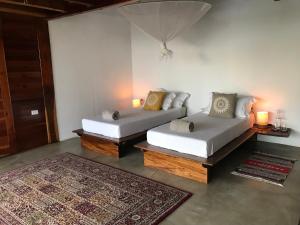 מיטה או מיטות בחדר ב-Todo Bien Nicaragua