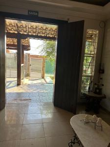 an open door to a patio in a house at Casa Grande Hospedagem in Brumadinho