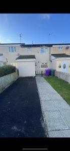 a parking lot in front of a building at Entire 3 bedrooom holiday home in Liverpool