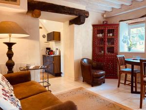 a living room with a couch and a table at Gîte des Fougères in Cherbourg en Cotentin