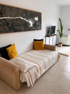 מיטה או מיטות בחדר ב-Dpto Pellegrini