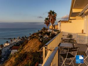 a view of the ocean from the balcony of a hotel at [Tropea]Luxury Terrace Sea Suite in Tropea