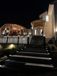 a group of stairs leading to a building at night at FUJIYUKI in Yamanakako