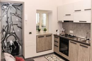 a kitchen with a sink and a stove at Vista sull'Eremo in Naples