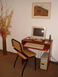 a desk with a computer and a chair in a room at APART OBELISCO CENTRO AA Wi Fi in Buenos Aires