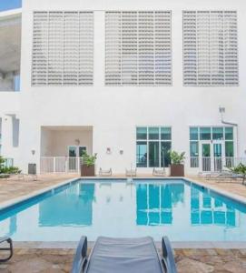 a swimming pool in front of a building at Stylish 2br Apt in Downtown City View 3208 in Miami