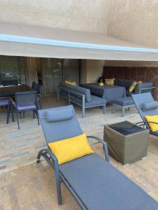 a group of chairs and couches in a building at fleur de marrakech in Marrakesh