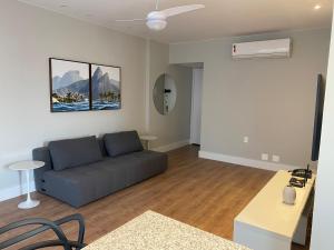 a living room with a couch and a table at Palace 802 in Rio de Janeiro