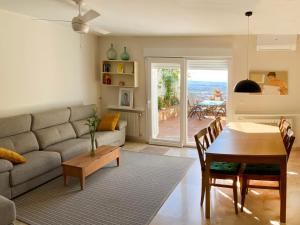 a living room with a couch and a table at VillaSanMiguelAlto in Granada