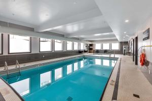a large swimming pool in a building at Sandman Hotel Grande Prairie in Grande Prairie +46 photos
