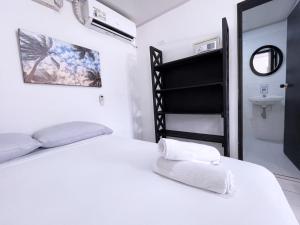 Una cama o camas en una habitación de Island Vibes