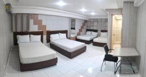Postel nebo postele na pokoji v ubytování HOTEL SAN THOMAS INN + 9 fotografií
