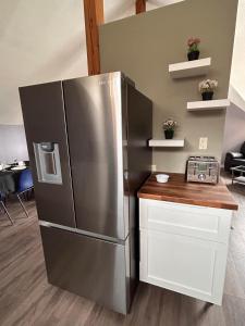 a large stainless steel refrigerator in a kitchen at Mountain Magic in Golden
