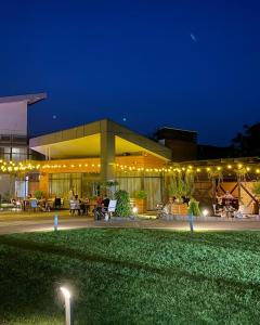 a building with lights on it at night at Motel Kurortnyy & SPA in Shklo