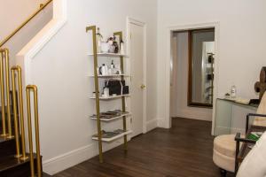 a room with a shelf with products on it at Serenity in the Marigny in New Orleans