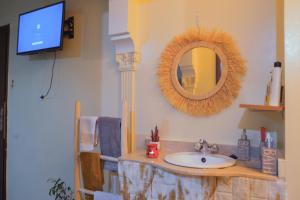 a bathroom with a sink and a mirror at Simons house in Marrakech