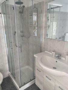 a bathroom with a shower and a sink at Lo scrigno dei nonni in Ovada +17 photos
