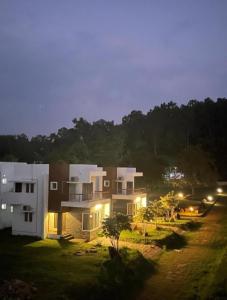 a view of a house at night with lights at Villa 65 - Eco Village - Easy Stays Yelagiri - Air Conditioned - Free Wifi - No Alcohol Zone in Yelagiri