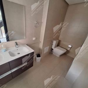 a bathroom with a sink and a toilet at Blue Haven Villa 4 bedroomTaghazout Bay Amda in Taghazout