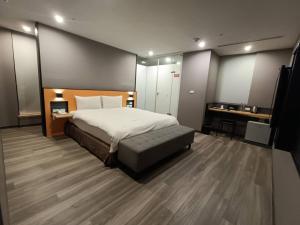 Letto o letti in una camera di Walker-Taoyuan