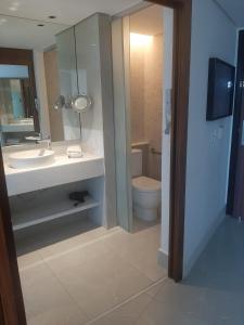 a bathroom with a sink and a toilet at Hotel Nacional in Rio de Janeiro