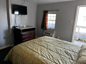 Posteľ alebo postele v izbe v ubytovaní Grand Howell Inn