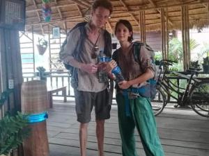 a man and a woman standing next to each other at Champa Guesthouse in Muang Không