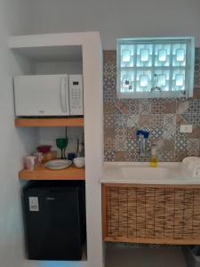 Nhà bếp/bếp nhỏ tại Recanto da Praia Kitnetes +52 ảnh