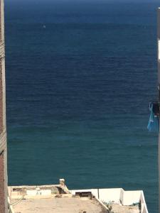 a view of the ocean from a building at شقة in Alexandria