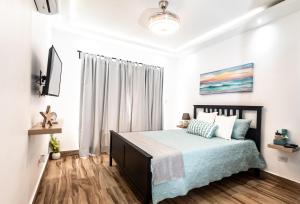 Postel nebo postele na pokoji v ubytování Apartamento A 800 metros de la Playa de Bayahibe