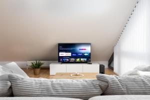TV a/nebo společenská místnost v ubytování Ruhe, Romantik und Ruhrgebiet vereint für Zwei