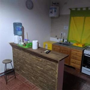 a kitchen with a counter top and a sink at Alojamiento Alquiler Temporario in Las Flores