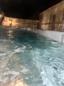 a swimming pool at night with blue water at HideOut City in Riverview