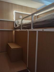 Letto o letti a castello in una camera di Suzhou MeetU Intl Youth Hostel