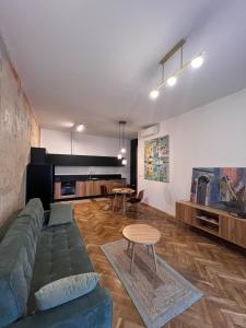 a living room with a couch and a table at Apartamenty Rynek 18 in Żywiec