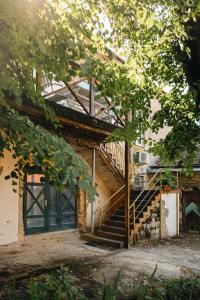 an old building with a staircase in front of it at 20 stairs in Vilnius