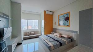 Ένα ή περισσότερα κρεβάτια σε δωμάτιο στο Apartemen Sentraland Semarang +20 φωτογραφίες