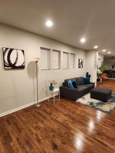 a living room with a couch and a table at The Relaxation Oasis in Philadelphia