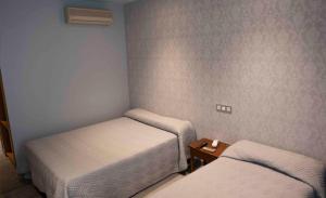 Postel nebo postele na pokoji v ubytování Hotel Simancas