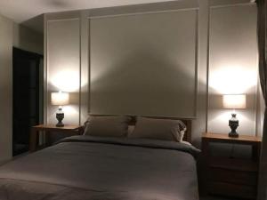 Ένα ή περισσότερα κρεβάτια σε δωμάτιο στο Hotel Sanset