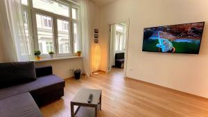 Televízia a/alebo spoločenská miestnosť v ubytovaní Residence Neverin Trieste