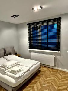 Postel nebo postele na pokoji v ubytování Apartamenty Zielona