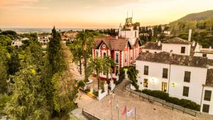 an aerial view of a town with a building at Hotel Finca Los Abetos in Córdoba