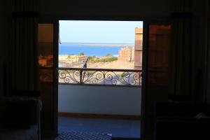 a view of the ocean from a balcony at heart of town sea view in Safaga 