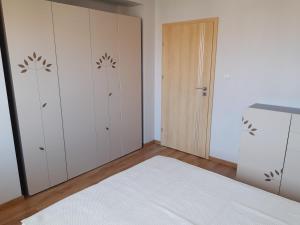 Apartament Leska tesisinde bir odada yatak veya yataklar
