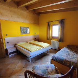 Postel nebo postele na pokoji v ubytování Al Dos