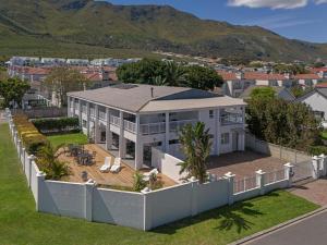 an aerial view of a house with a fence at Oude Schuur Boutique Guesthouse in Hermanus