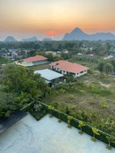 an aerial view of a town with mountains in the background at Mountain&Sea Hotel Prachuap in Prachuap Khiri Khan